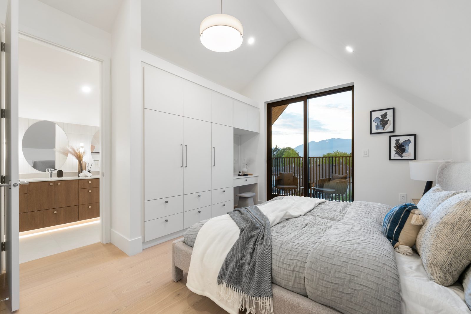 The Eton — primary bedroom with balcony and view